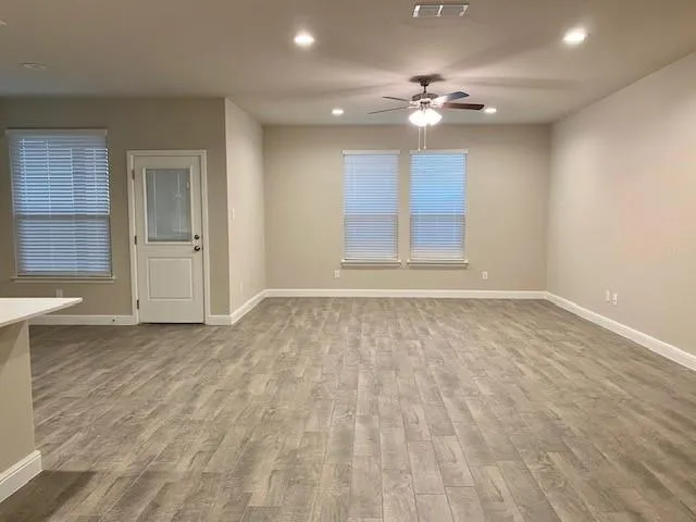 a kitchen with kitchen island a sink stainless steel appliances and cabinets