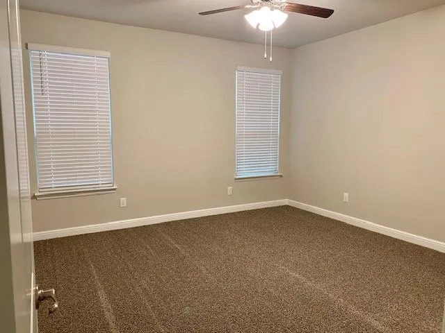 a bathroom with a shower sink vanity and mirror