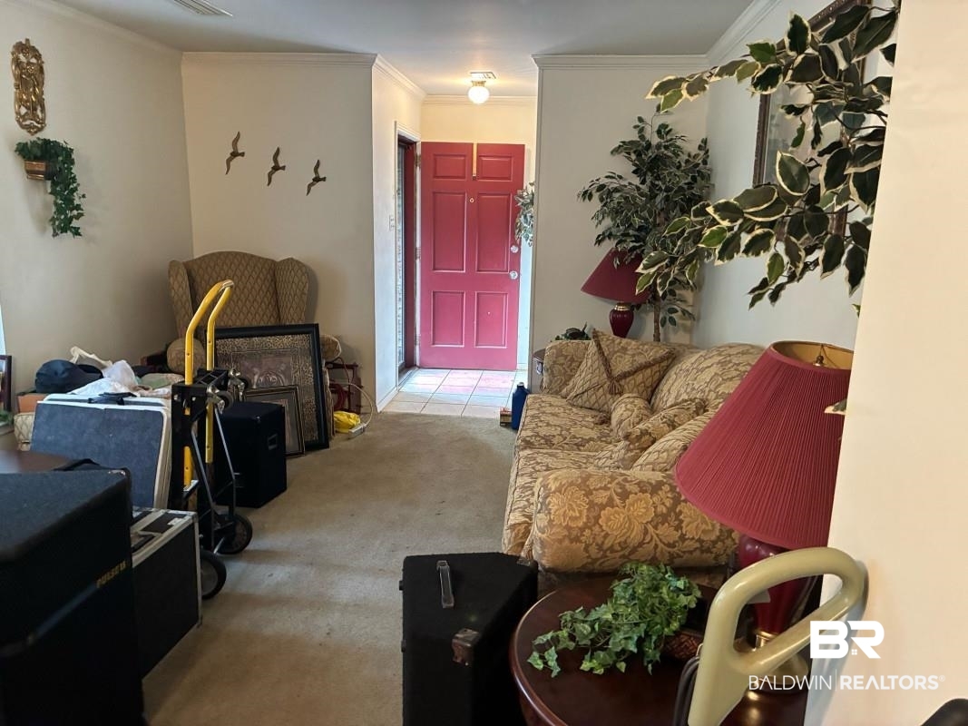 514 Nantucket Circle Mobile, AL 36609 - Photo 6 of 13 Living area featuring carpet flooring and ornamental molding