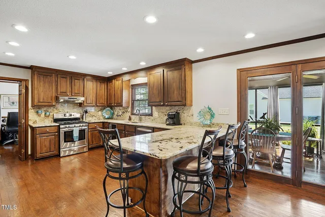 a kitchen with a table and chairs in it