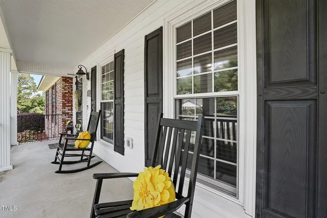 a view of swimming pool with chairs