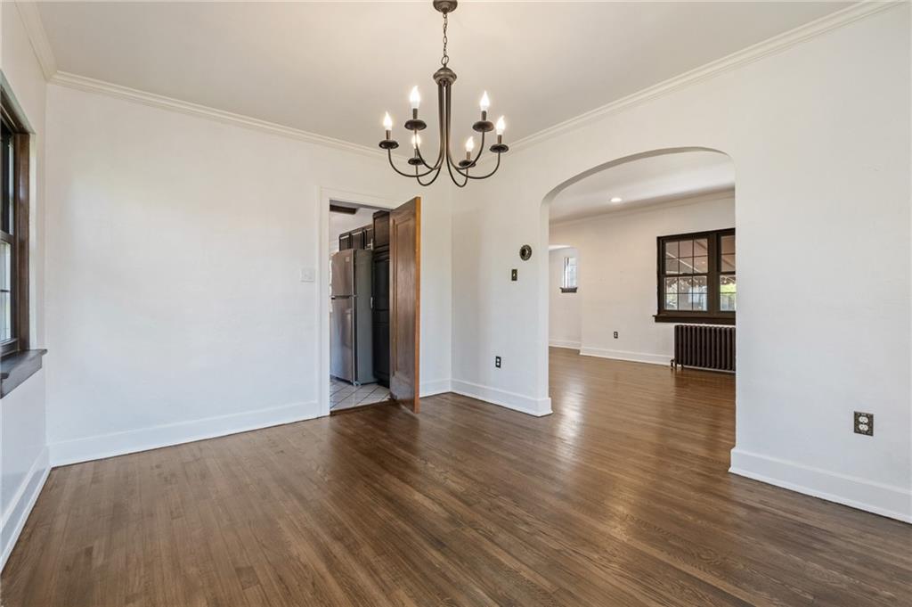 1516 Riverside Drive Verona, PA 15147 - Photo 12 of 38 a view of an empty room with wooden floor and a window
