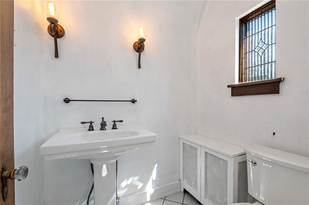 1516 Riverside Drive Verona, PA 15147 - Photo 13 of 38 a bathroom with a sink and a mirror