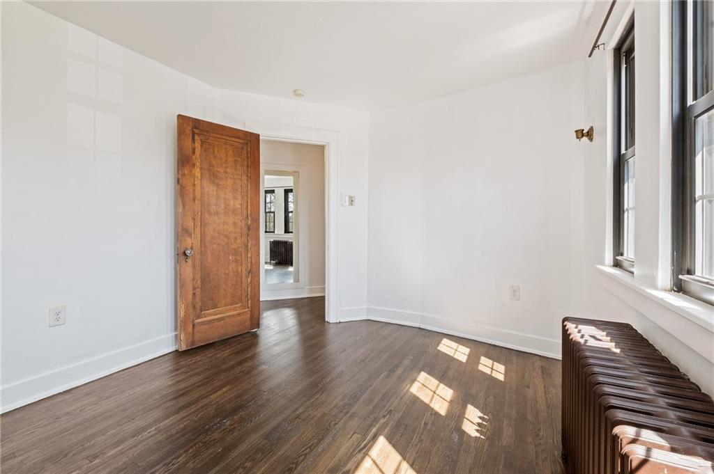 1516 Riverside Drive Verona, PA 15147 - Photo 15 of 38 a view of an empty room with wooden floor and a window