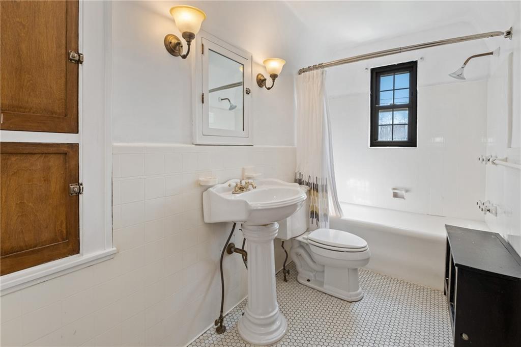 1516 Riverside Drive Verona, PA 15147 - Photo 16 of 38 a bathroom with a sink toilet and a mirror