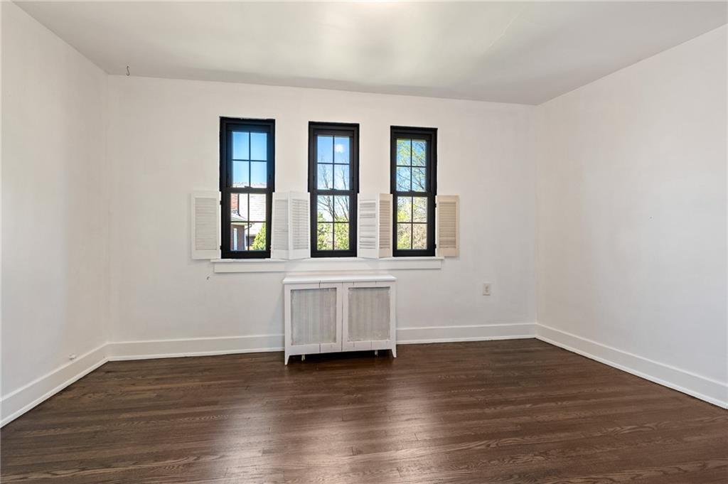 1516 Riverside Drive Verona, PA 15147 - Photo 21 of 38 a view of an empty room with wooden floor and a window