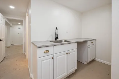 a bathroom with a toilet a sink and a mirror
