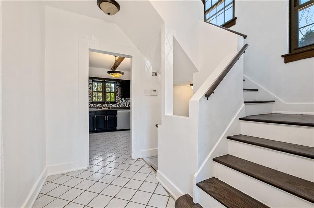 1516 Riverside Drive Verona, PA 15147 - Photo 34 of 38 a view of a hallway with wooden floor and staircase
