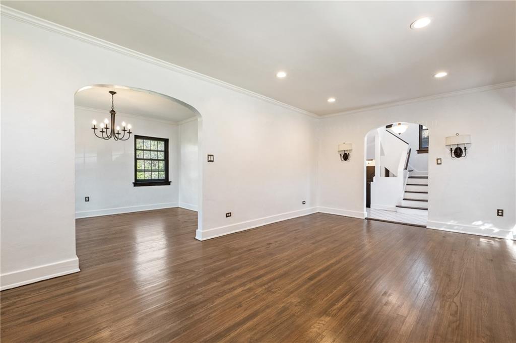 1516 Riverside Drive Verona, PA 15147 - Photo 4 of 38 an empty room with wooden floor and mirror