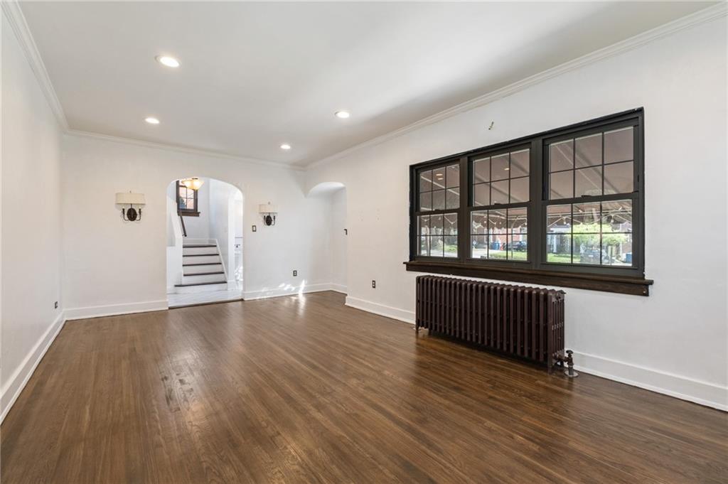 1516 Riverside Drive Verona, PA 15147 - Photo 5 of 38 a view of an empty room with a window and wooden floor