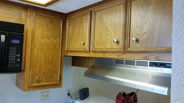 a view of a door and wooden floor