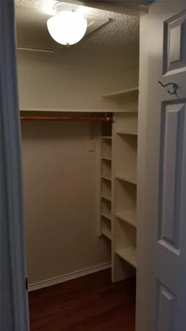 a view of a store room with wooden floor