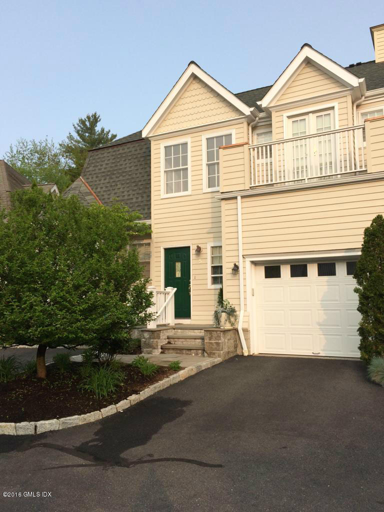 48 Spring Street, Unit 5 Greenwich, CT 06830 - Photo 4 of 26 a view of a house with a yard