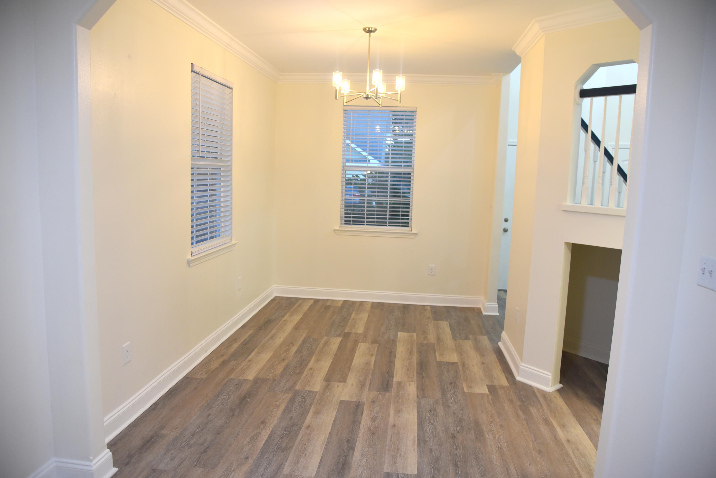 149 Legion Park Loop Miramar Beach, FL 32550 - Photo 16 of 89 a view of an empty room with wooden floor and a window