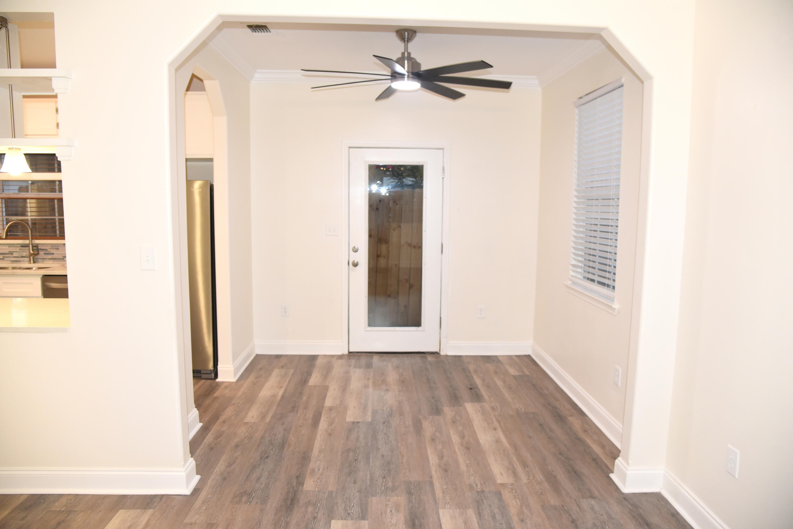 149 Legion Park Loop Miramar Beach, FL 32550 - Photo 21 of 89 a view of a hallway with wooden floor and a bathroom