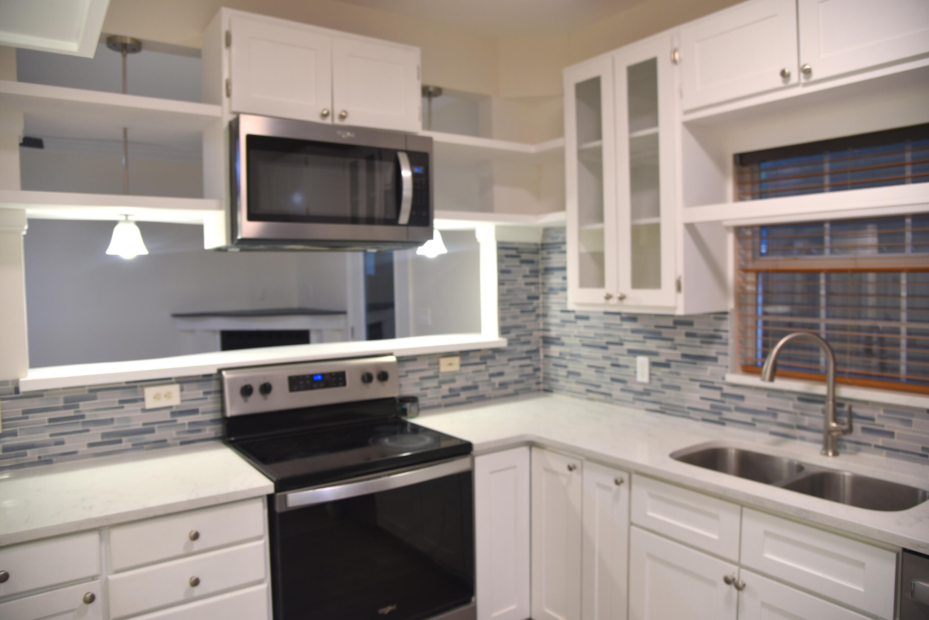 149 Legion Park Loop Miramar Beach, FL 32550 - Photo 29 of 89 a kitchen with a sink stove and microwave