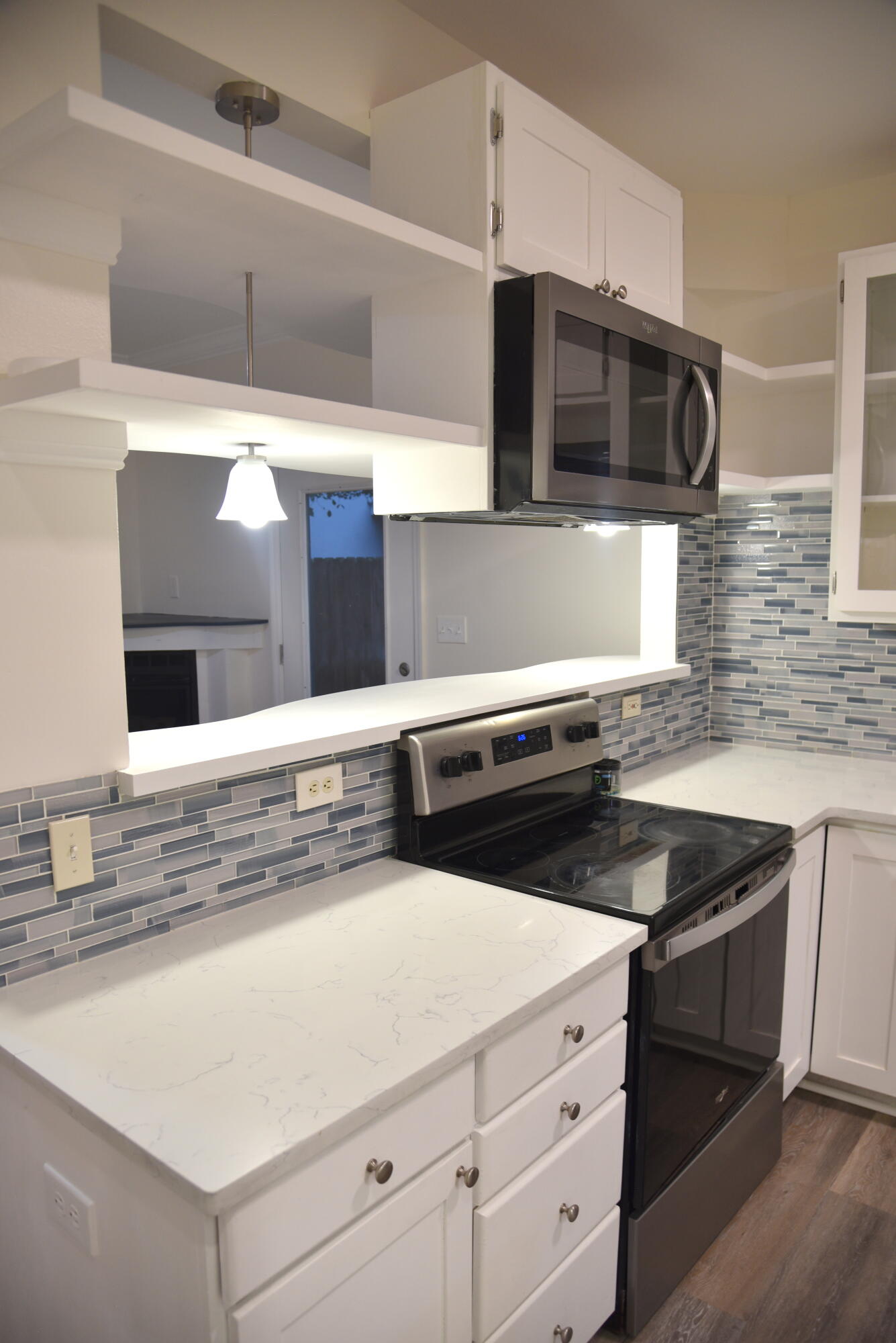 149 Legion Park Loop Miramar Beach, FL 32550 - Photo 31 of 89 a kitchen with stainless steel appliances a sink and a microwave