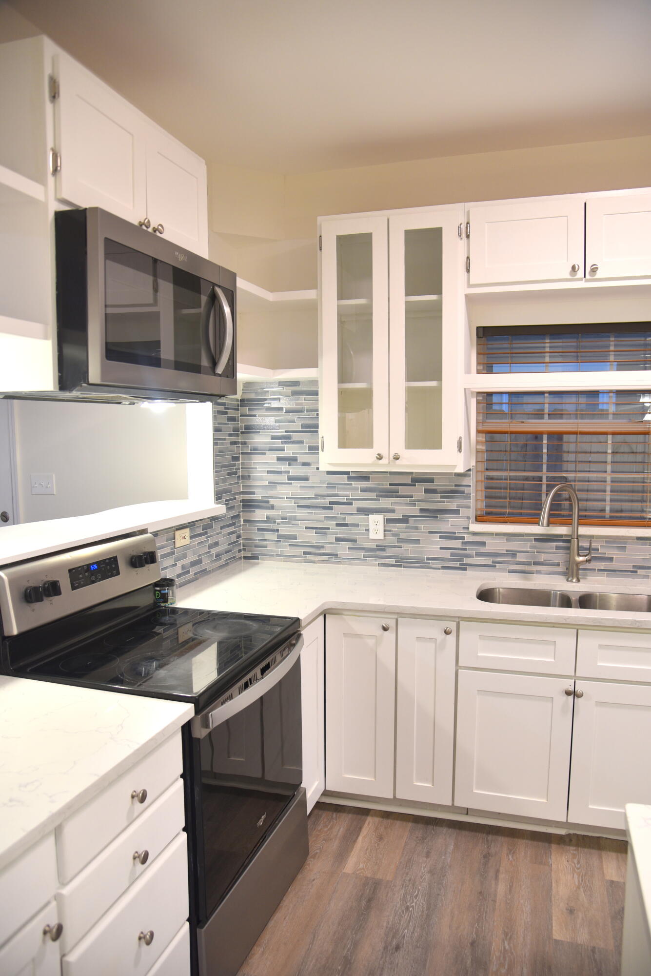 149 Legion Park Loop Miramar Beach, FL 32550 - Photo 32 of 89 a kitchen with stainless steel appliances granite countertop a stove and a microwave