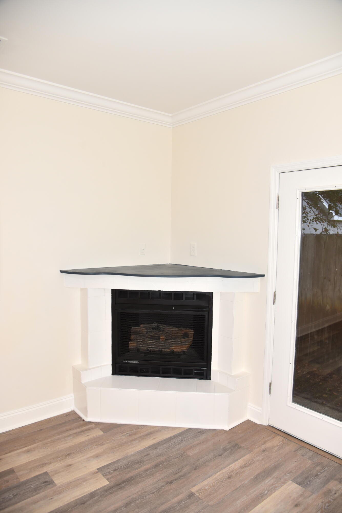 149 Legion Park Loop Miramar Beach, FL 32550 - Photo 42 of 89 a view of empty room with wooden floor and fireplace