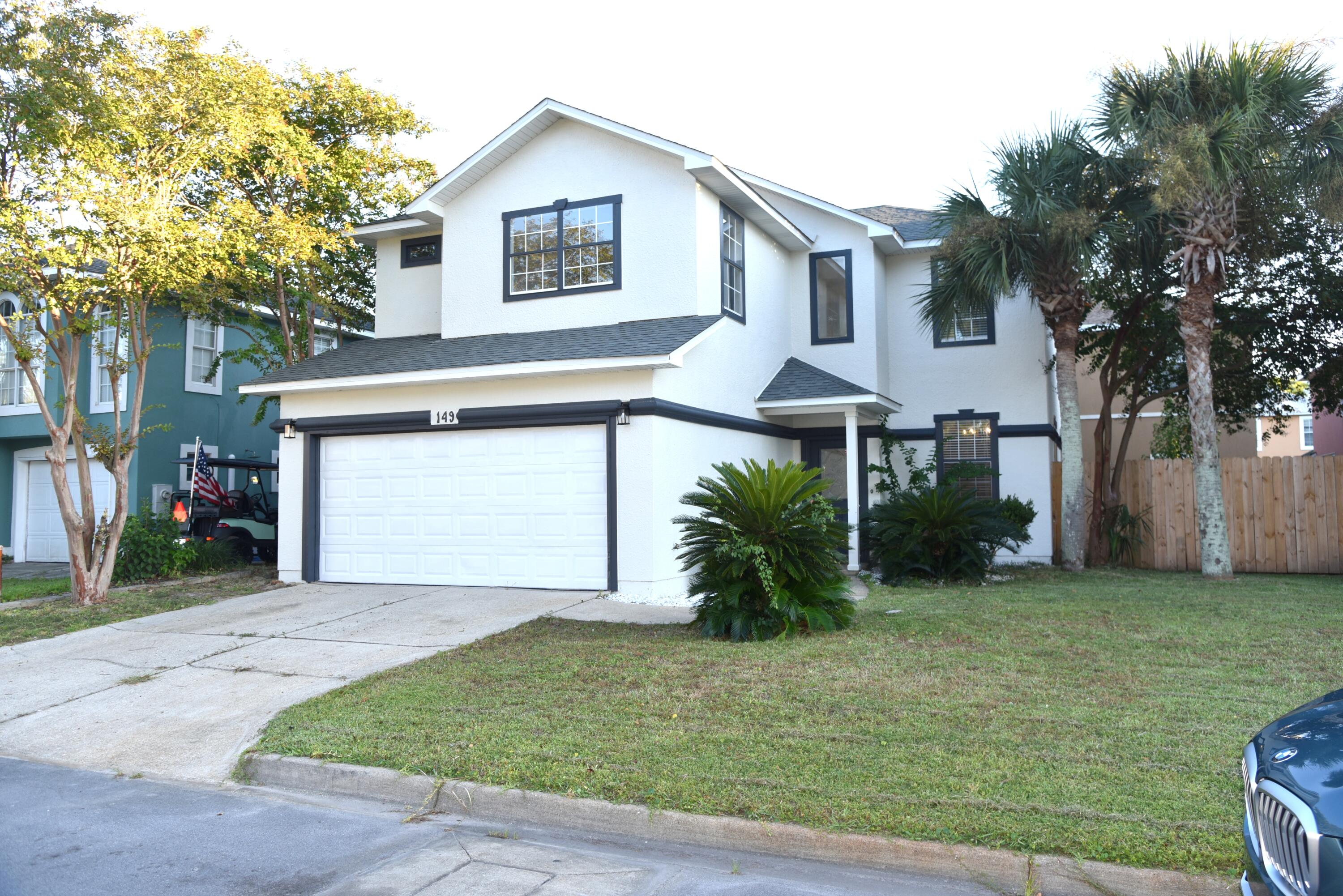 149 Legion Park Loop Miramar Beach, FL 32550 - Photo 5 of 89 a front view of a house with a yard and garage