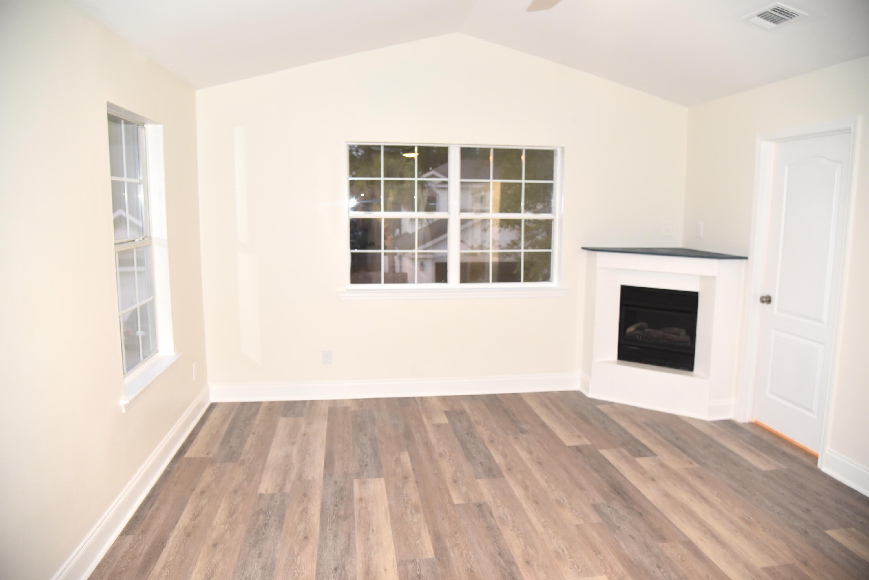 149 Legion Park Loop Miramar Beach, FL 32550 - Photo 57 of 89 a view of empty room with a window and wooden floor