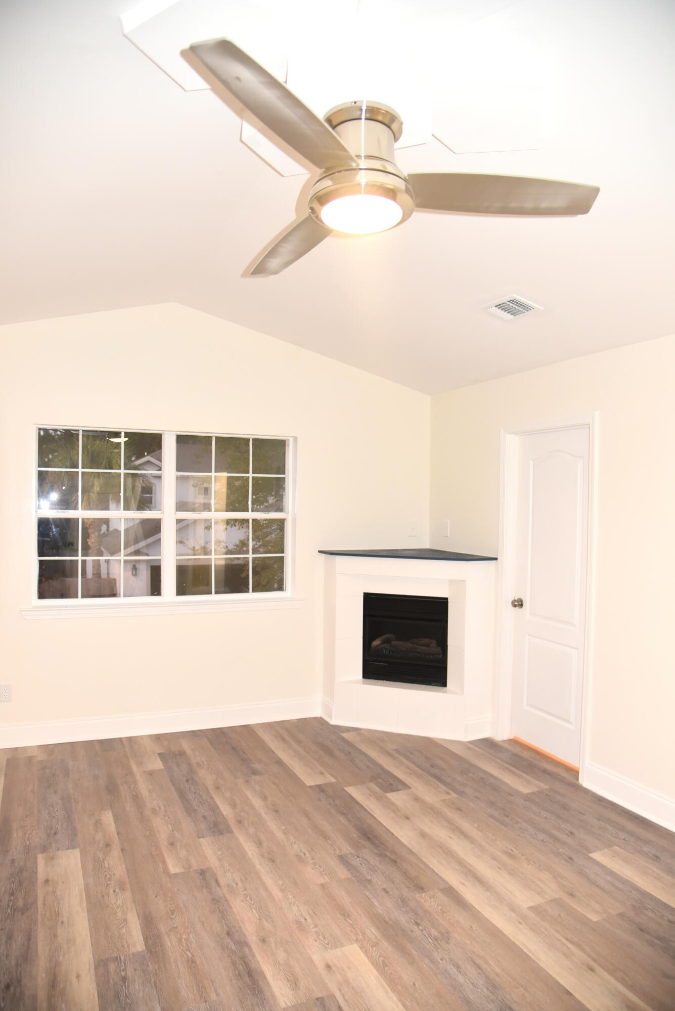 149 Legion Park Loop Miramar Beach, FL 32550 - Photo 58 of 89 a view of an empty room with a window and fireplace