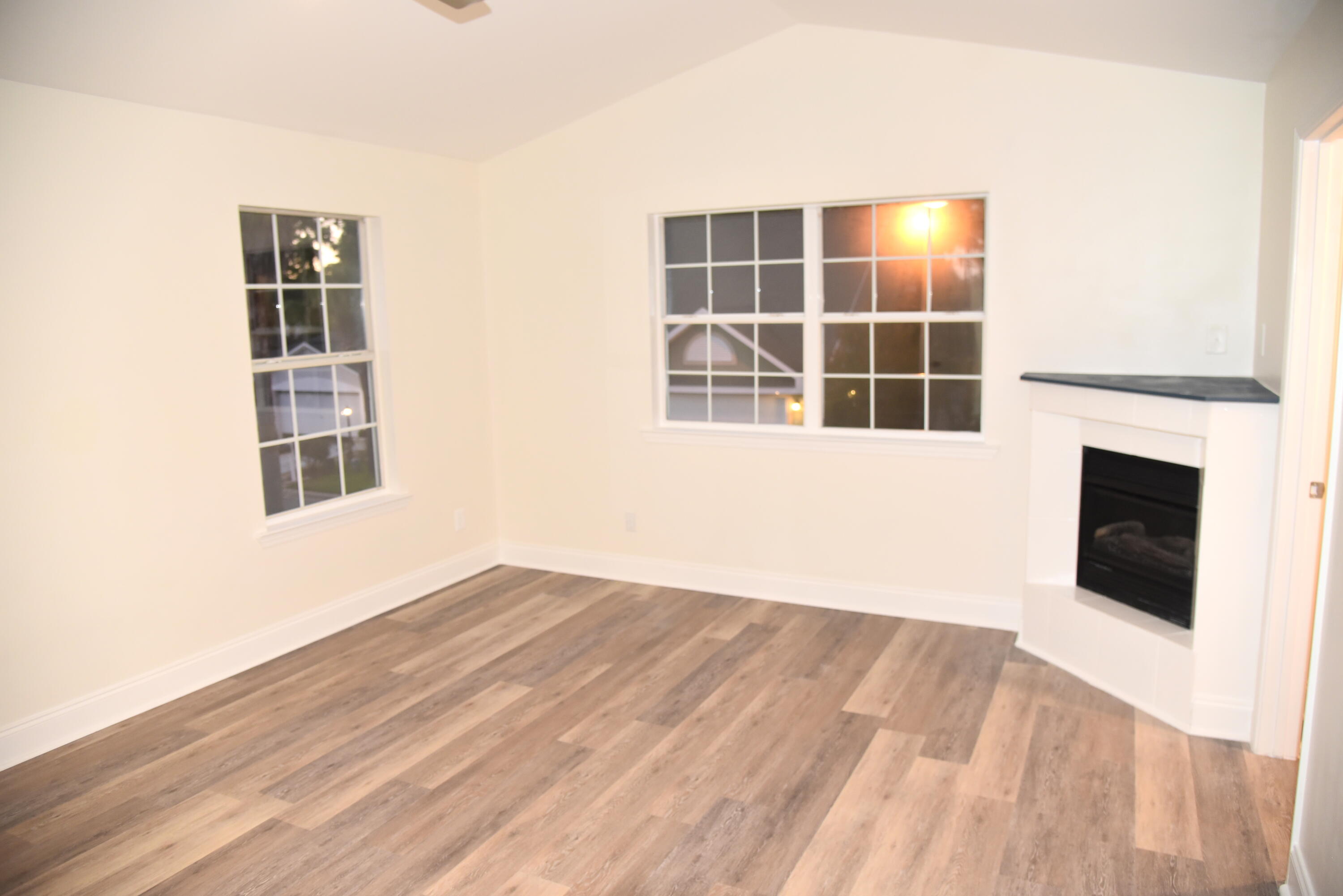 149 Legion Park Loop Miramar Beach, FL 32550 - Photo 64 of 89 a view of an empty room with wooden floor and a window