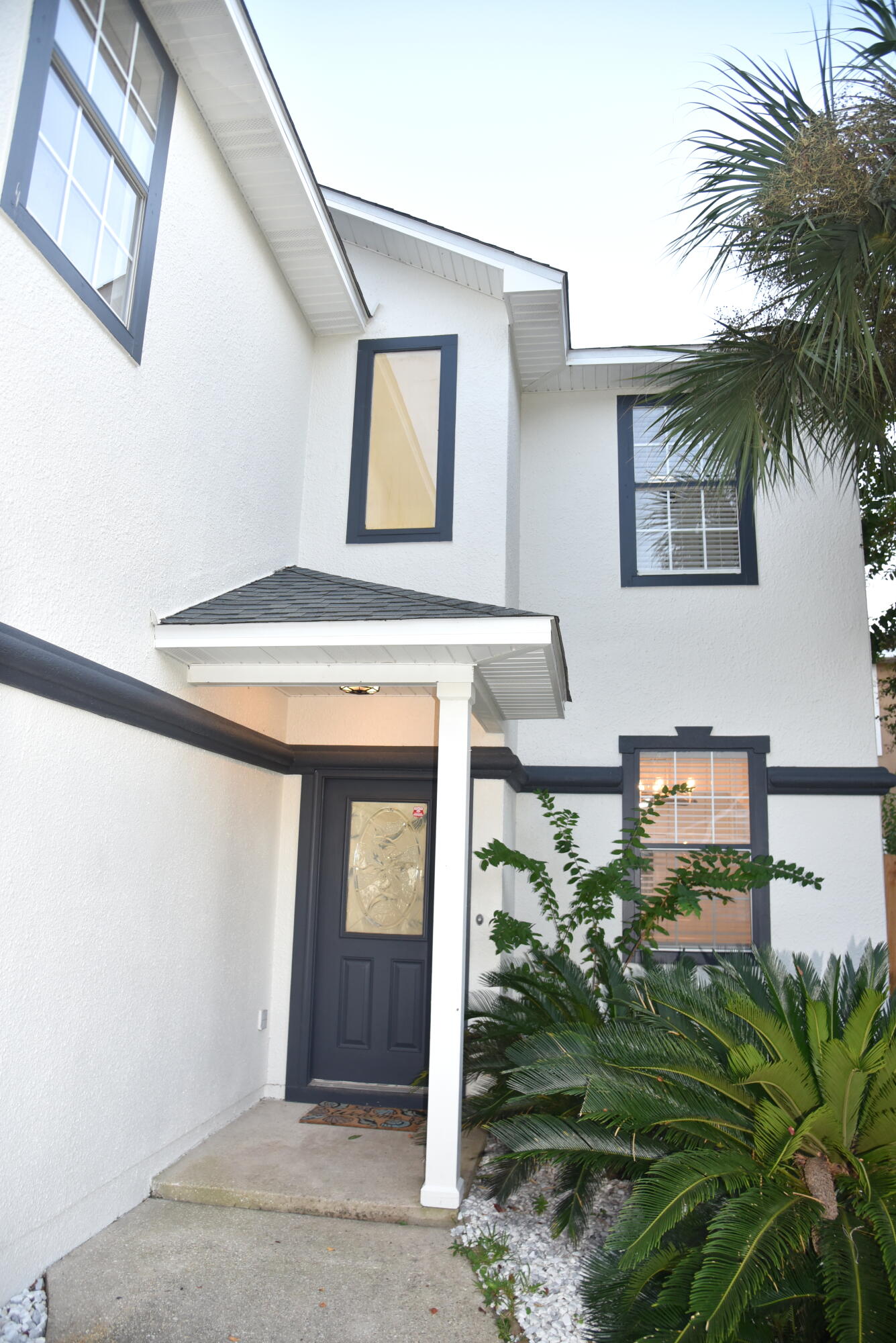 149 Legion Park Loop Miramar Beach, FL 32550 - Photo 7 of 89 a front view of a house with garden
