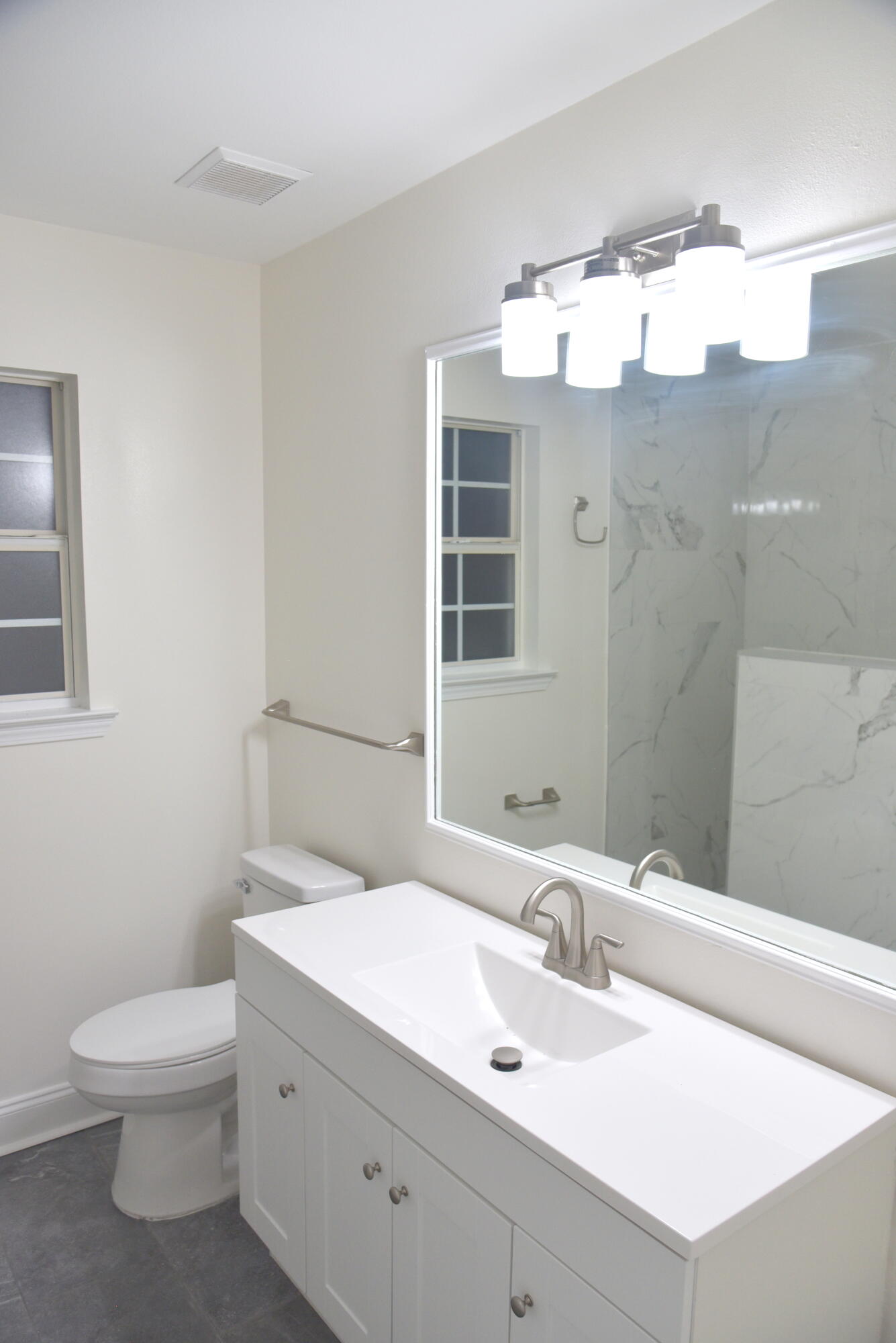 149 Legion Park Loop Miramar Beach, FL 32550 - Photo 81 of 89 a bathroom with a sink a toilet and mirror