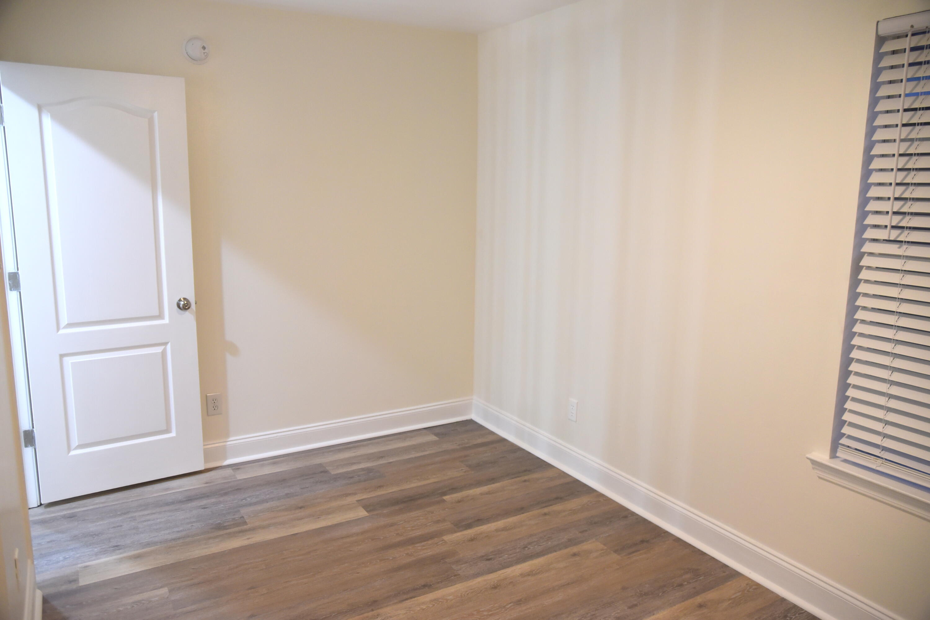 149 Legion Park Loop Miramar Beach, FL 32550 - Photo 88 of 89 a view of an empty room with wooden floor and closet
