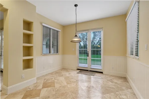 a view of an empty room with a fireplace