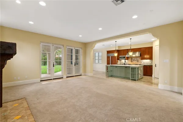 a view of a kitchen with a sink and a window