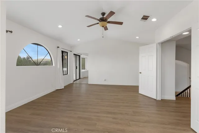 a large kitchen with stainless steel appliances granite countertop plenty wooden cabinets counter space a sink and a stove