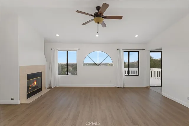 a bathroom with a double vanity sink a toilet a mirror and shower