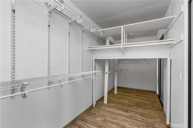 a white toilet sitting next to a bath tub