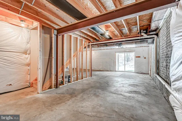 a view of an empty room with stairs
