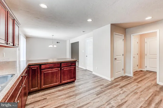 a view of kitchen with wooden floor