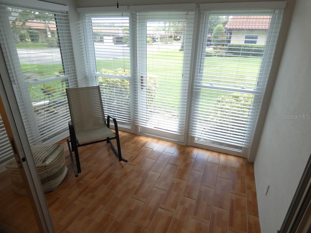 1701 Pinehurst Road, Unit 9G Dunedin, FL 34698 - Photo 5 of 22 a view of a room with wooden floor and a window