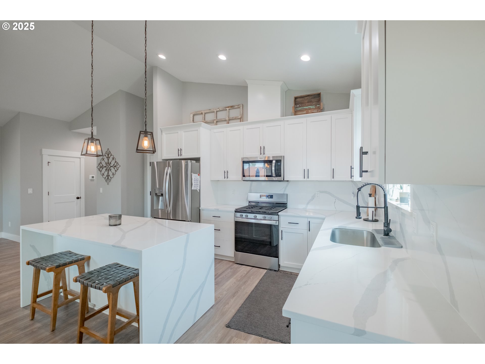 1006 Sassafras Street Independence, OR 97351 - Photo 11 of 47 a kitchen with kitchen island a sink stove and refrigerator
