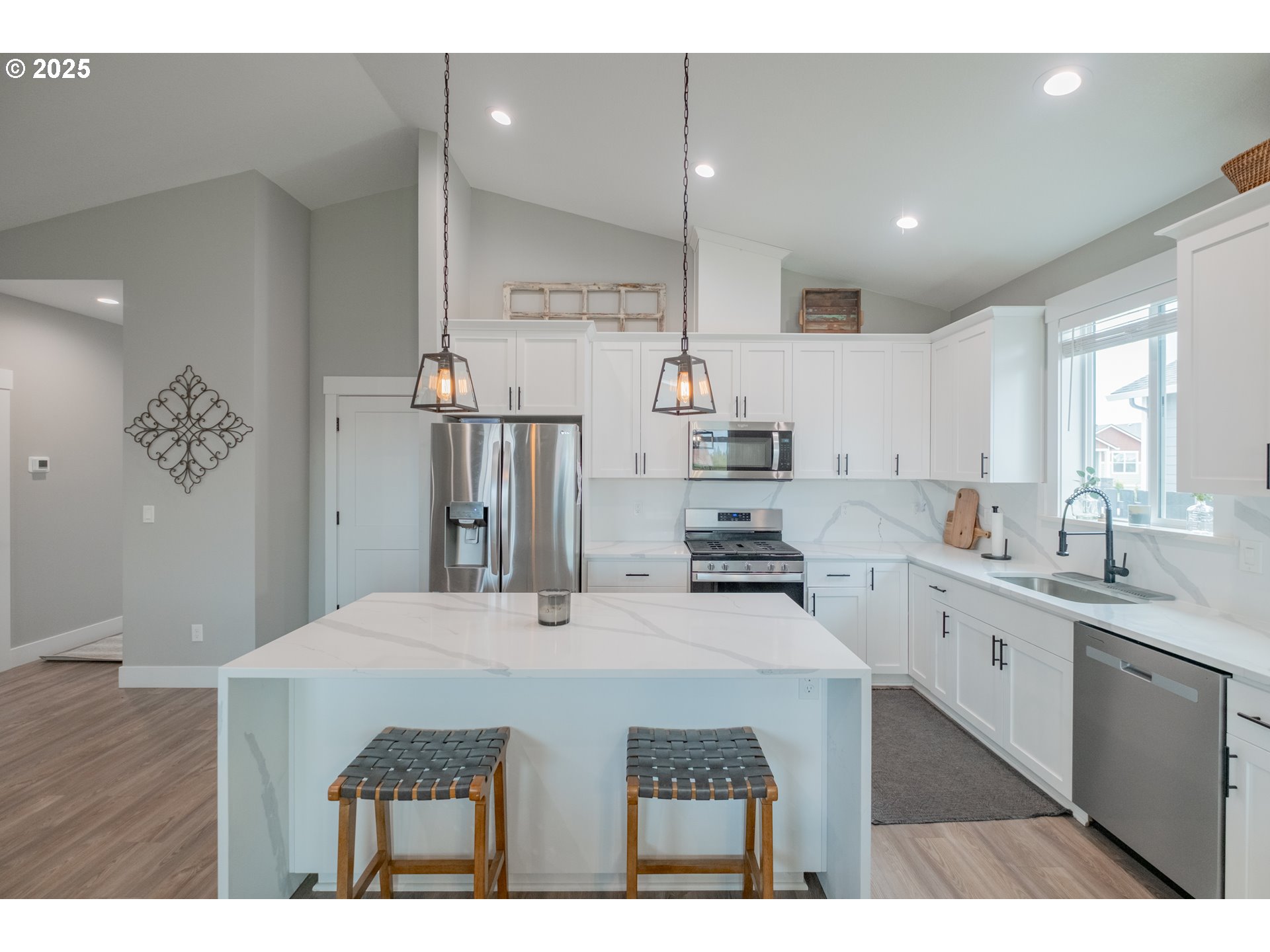 1006 Sassafras Street Independence, OR 97351 - Photo 12 of 47 a kitchen with stainless steel appliances kitchen island a sink stove and cabinets