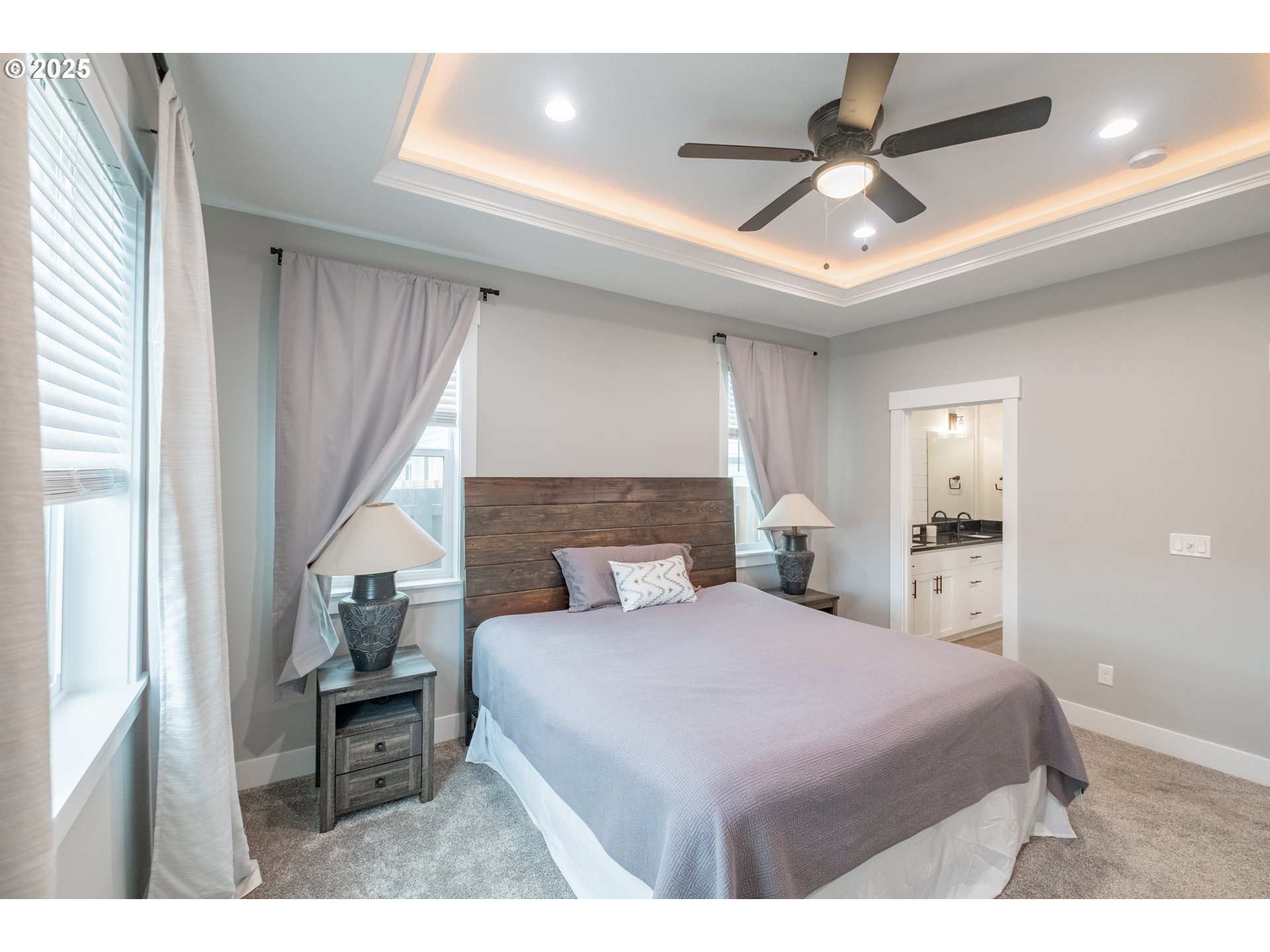 1006 Sassafras Street Independence, OR 97351 - Photo 26 of 47 a bedroom with a large bed and a chandelier