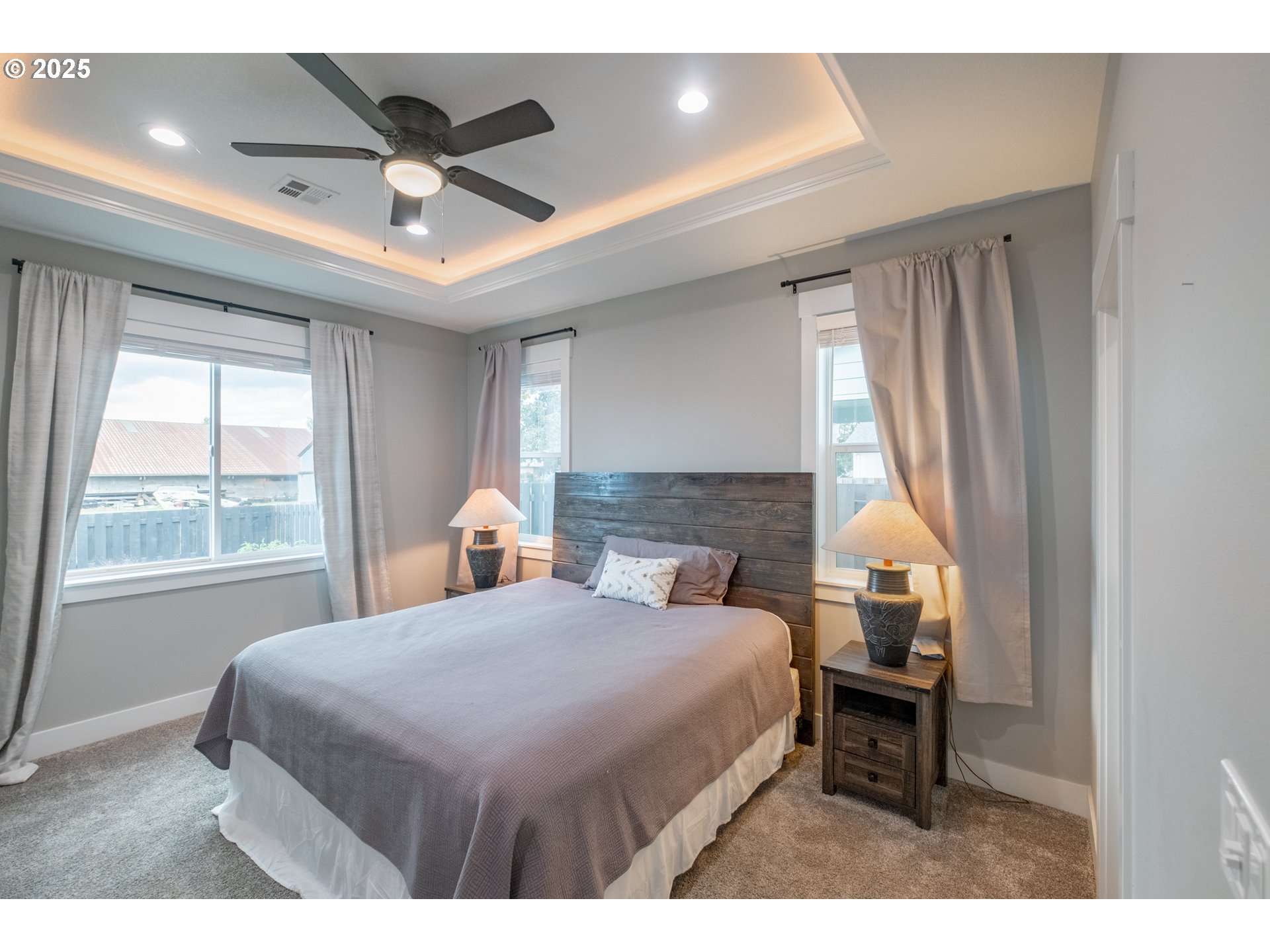 1006 Sassafras Street Independence, OR 97351 - Photo 27 of 47 a bedroom with a bed and a chandelier