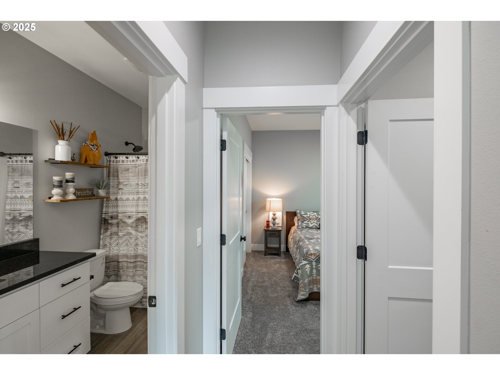 1006 Sassafras Street Independence, OR 97351 - Photo 33 of 47 a bathroom with a granite countertop sink a toilet and a shower