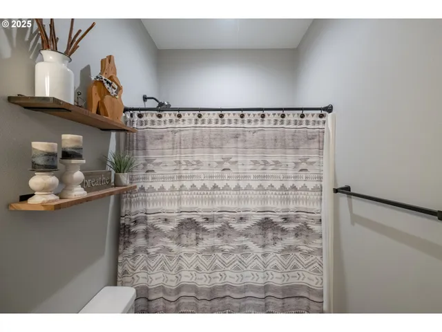 a view of a garden with a building in the background