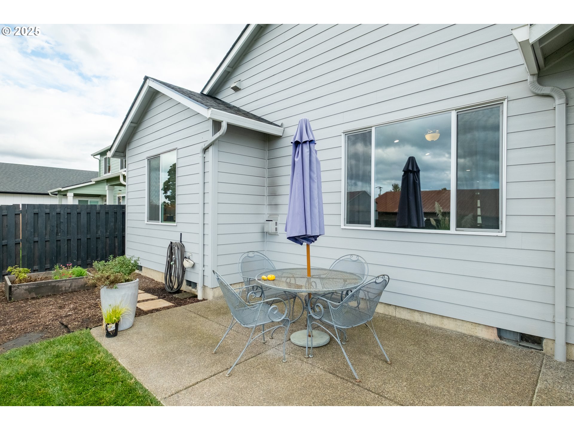 1006 Sassafras Street Independence, OR 97351 - Photo 42 of 47 a view of a patio with table and chairs and wooden fence