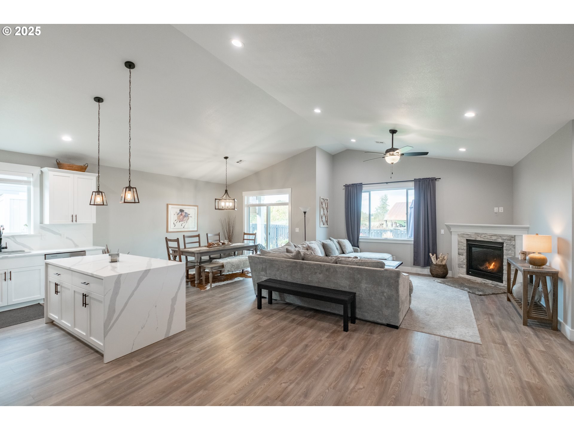 1006 Sassafras Street Independence, OR 97351 - Photo 9 of 47 a living room with furniture a fireplace a flat screen tv and a fireplace