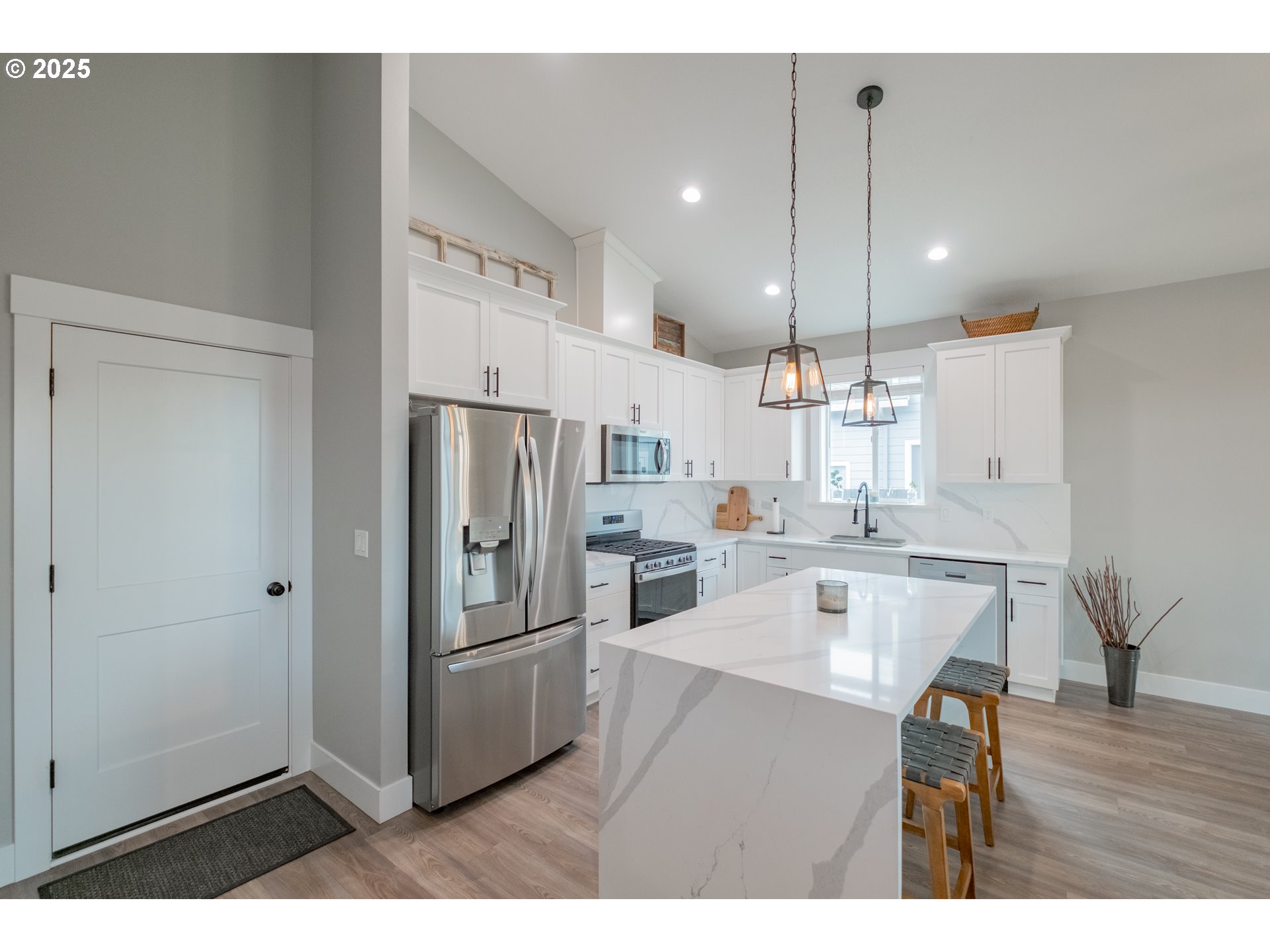 1006 Sassafras Street Independence, OR 97351 - Photo 10 of 47 a kitchen with refrigerator cabinets and wooden floor