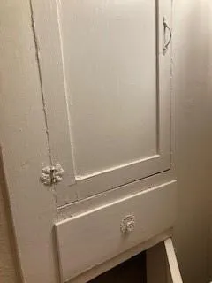 a white bath tub sitting next to a white toilet and sink