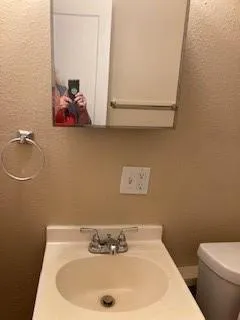 a kitchen with a stove and a refrigerator