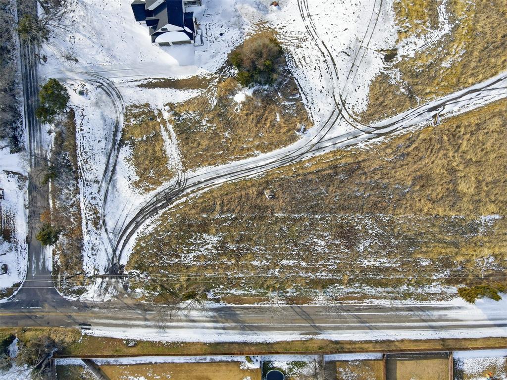 Lot 8 Beaver Creek Road Wylie, TX 75098 - Photo 5 of 6 a vase of flowers sitting on top of a table